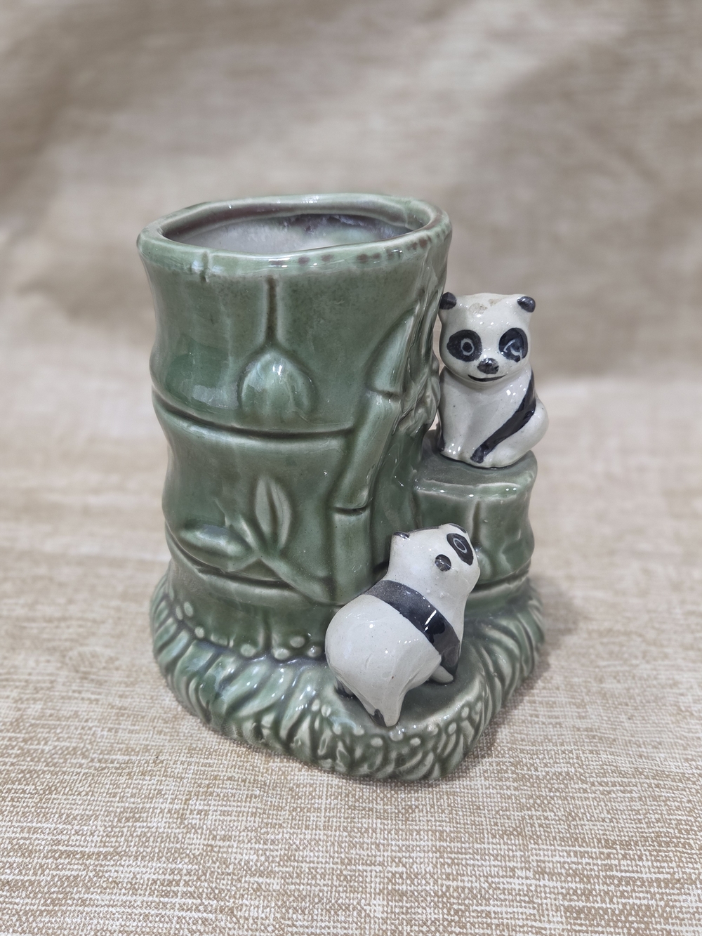 Vintage ceramic planter featuring two pandas and bamboo in a Majolica style
